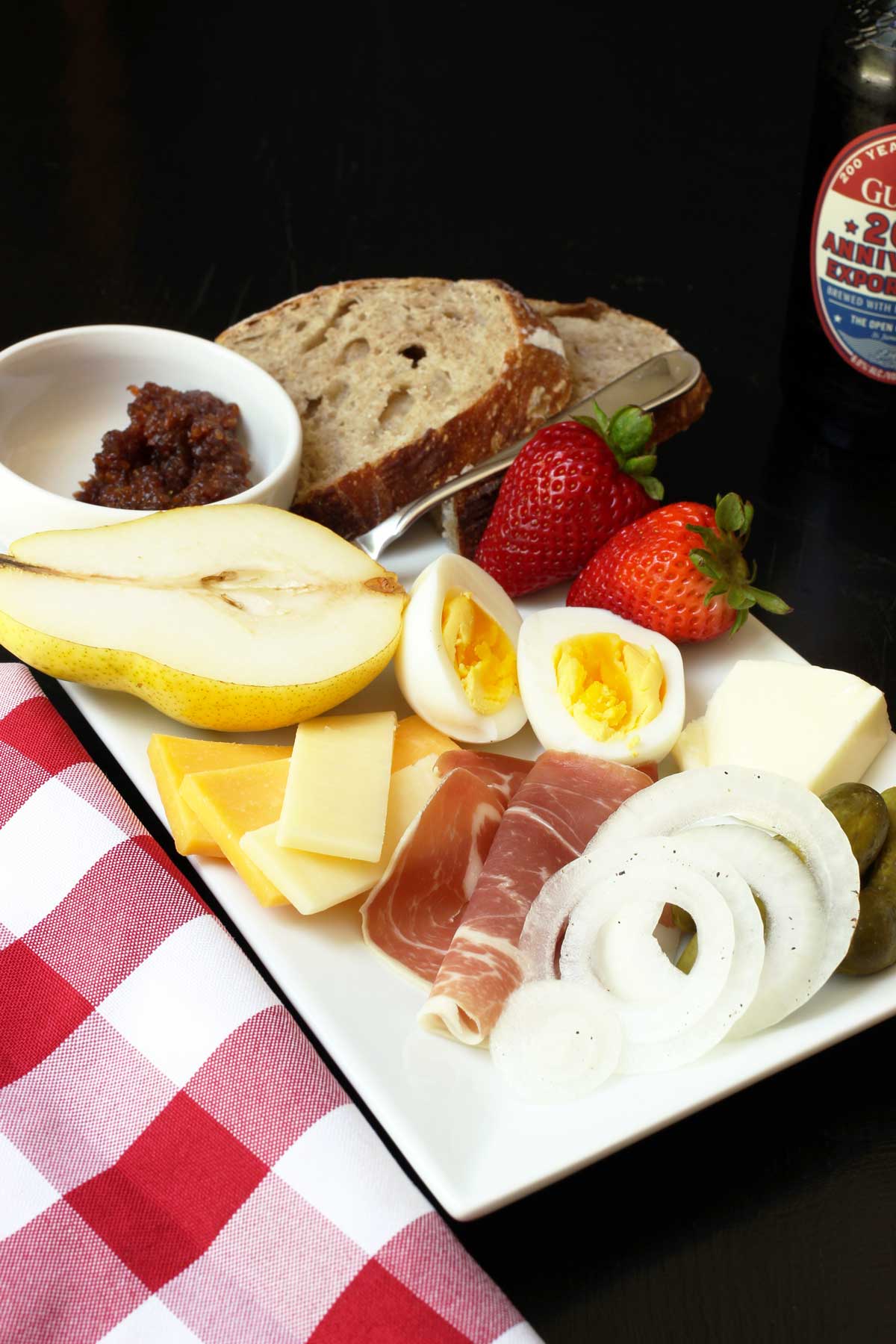 rectangular platter loaded with ploughman's lunch.
