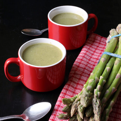 asparagus soup in red mugs