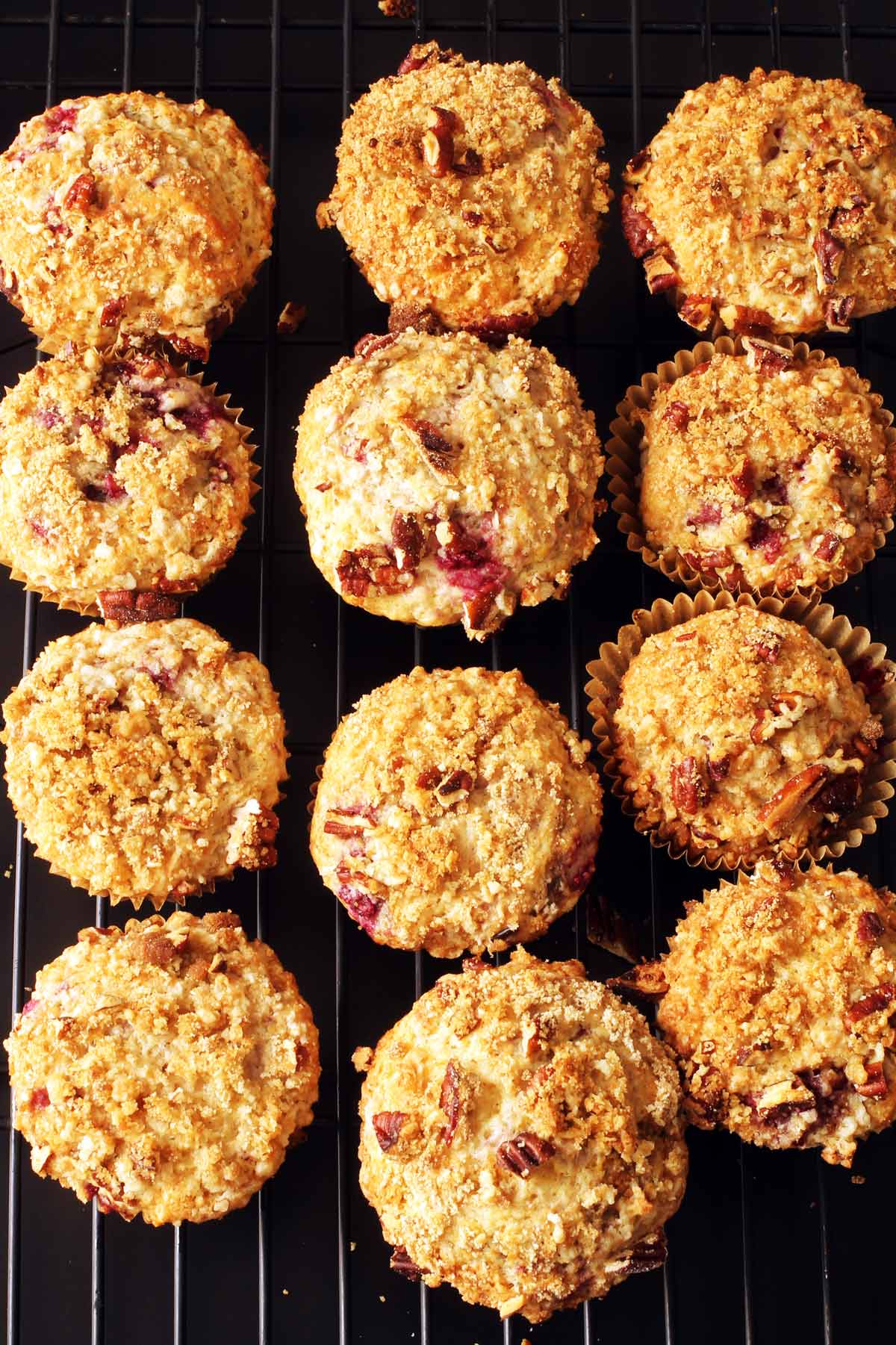 raspberry muffins cooling on rack.