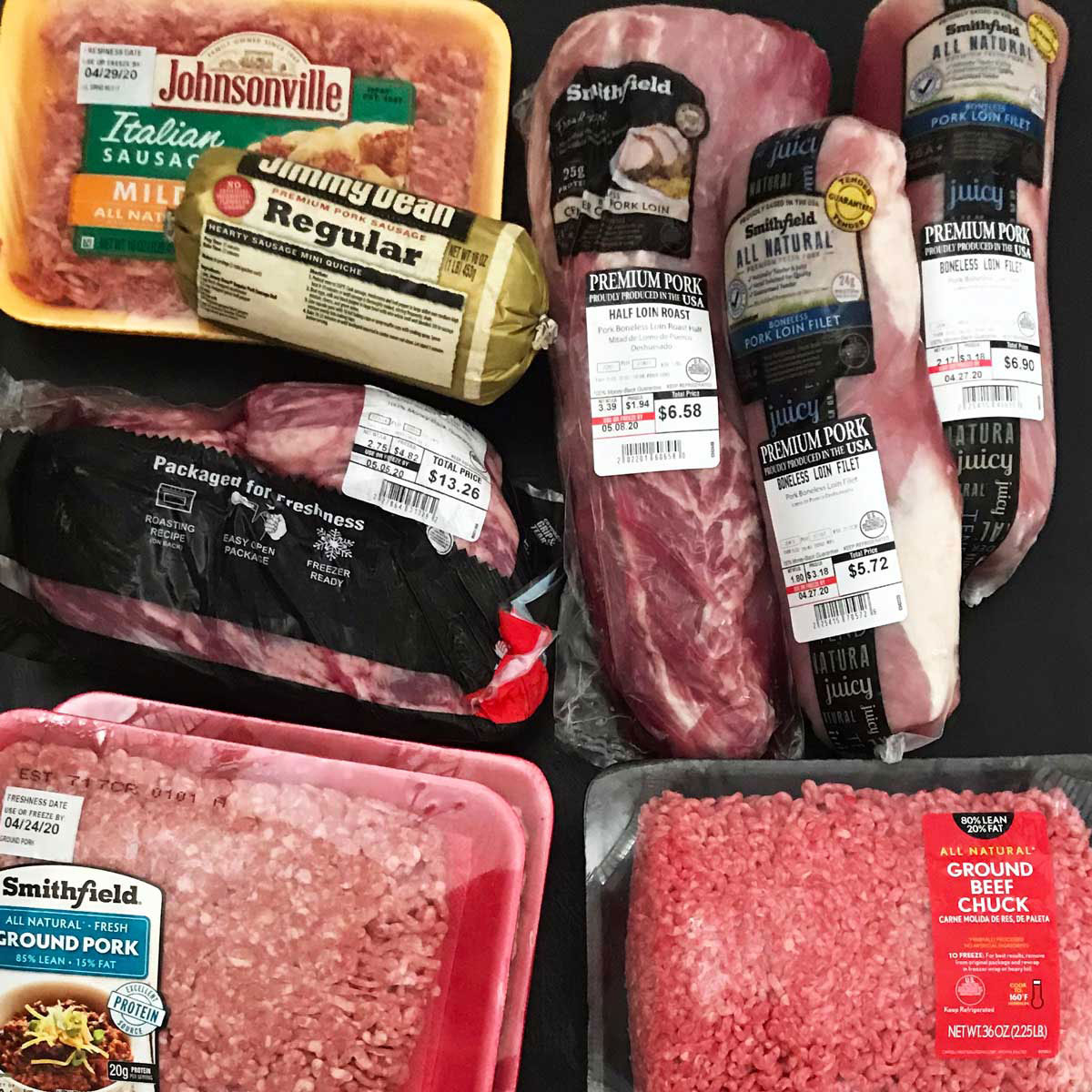 a variety of packages of meat items on table.