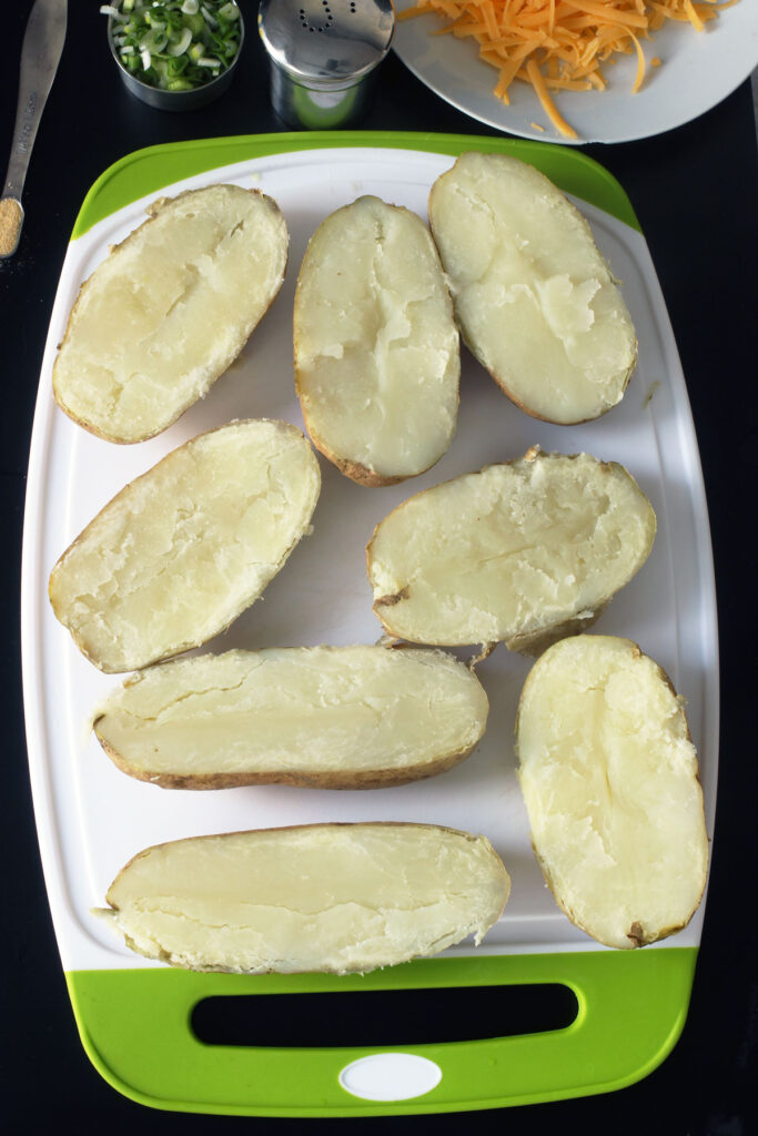potatoes cut in half on board