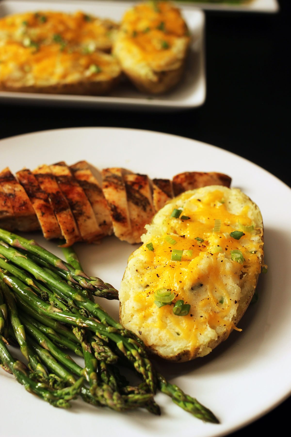 stuffed potato on dinner plate with meal