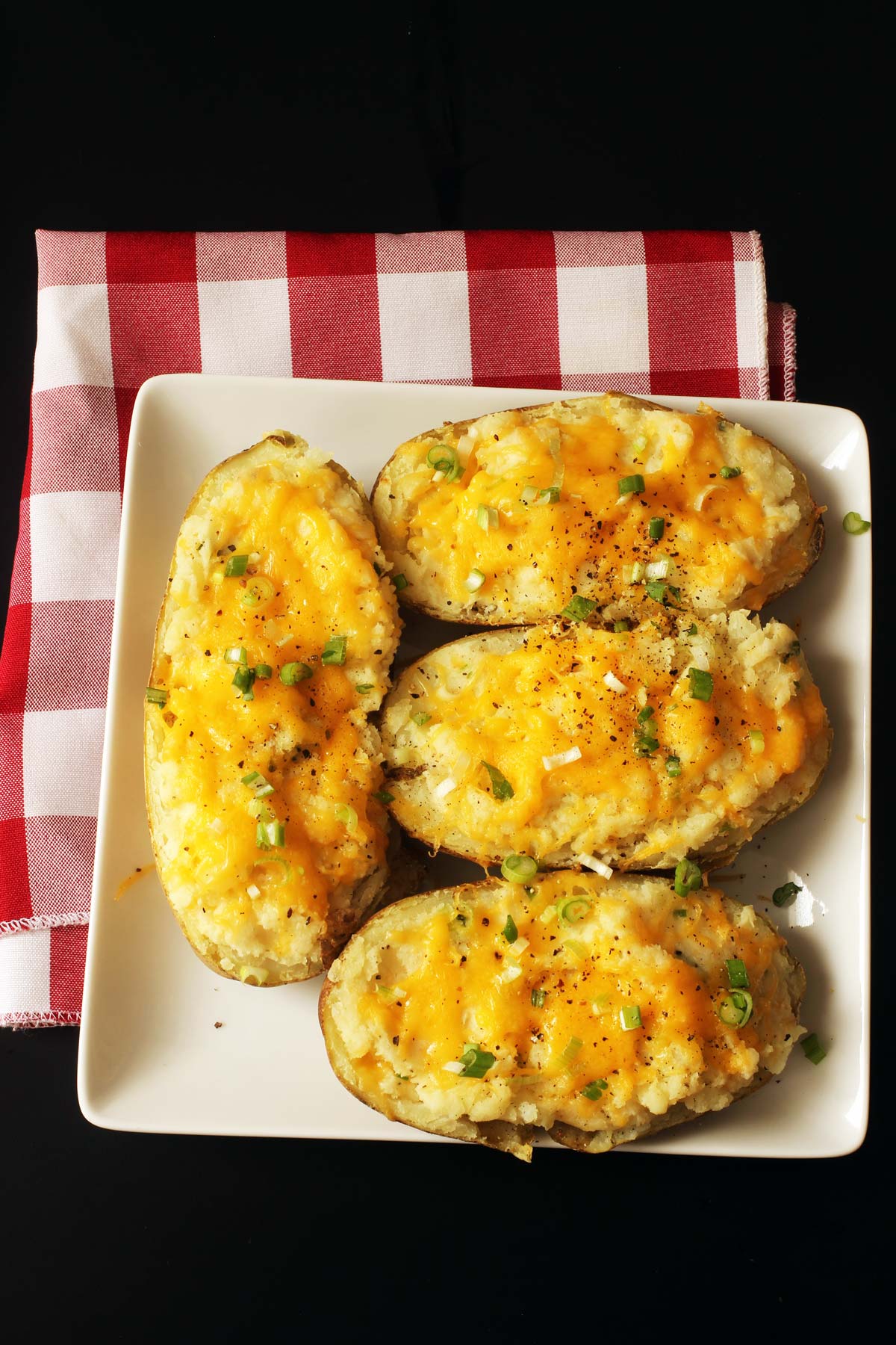 stuffed potatoes on square plate