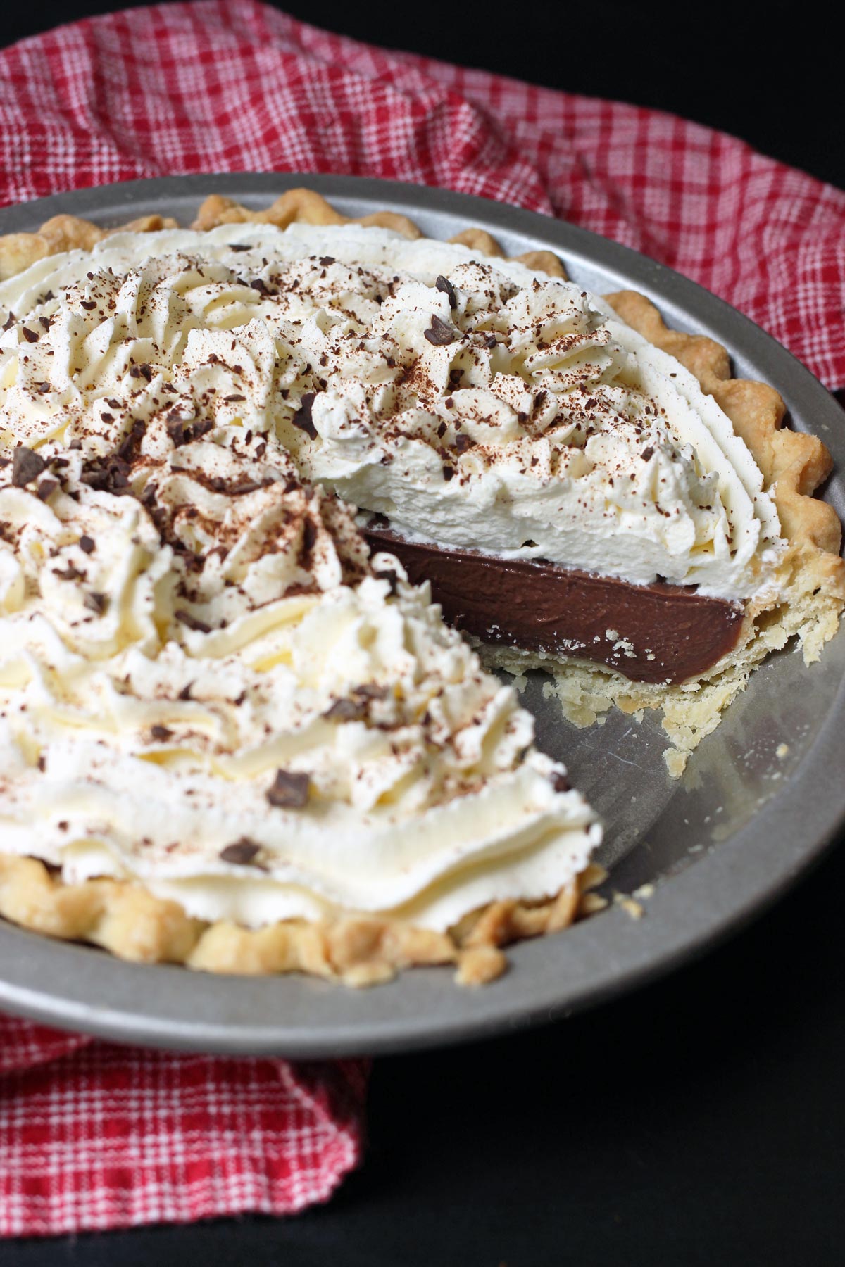 chocolate cream pie with wedge missing