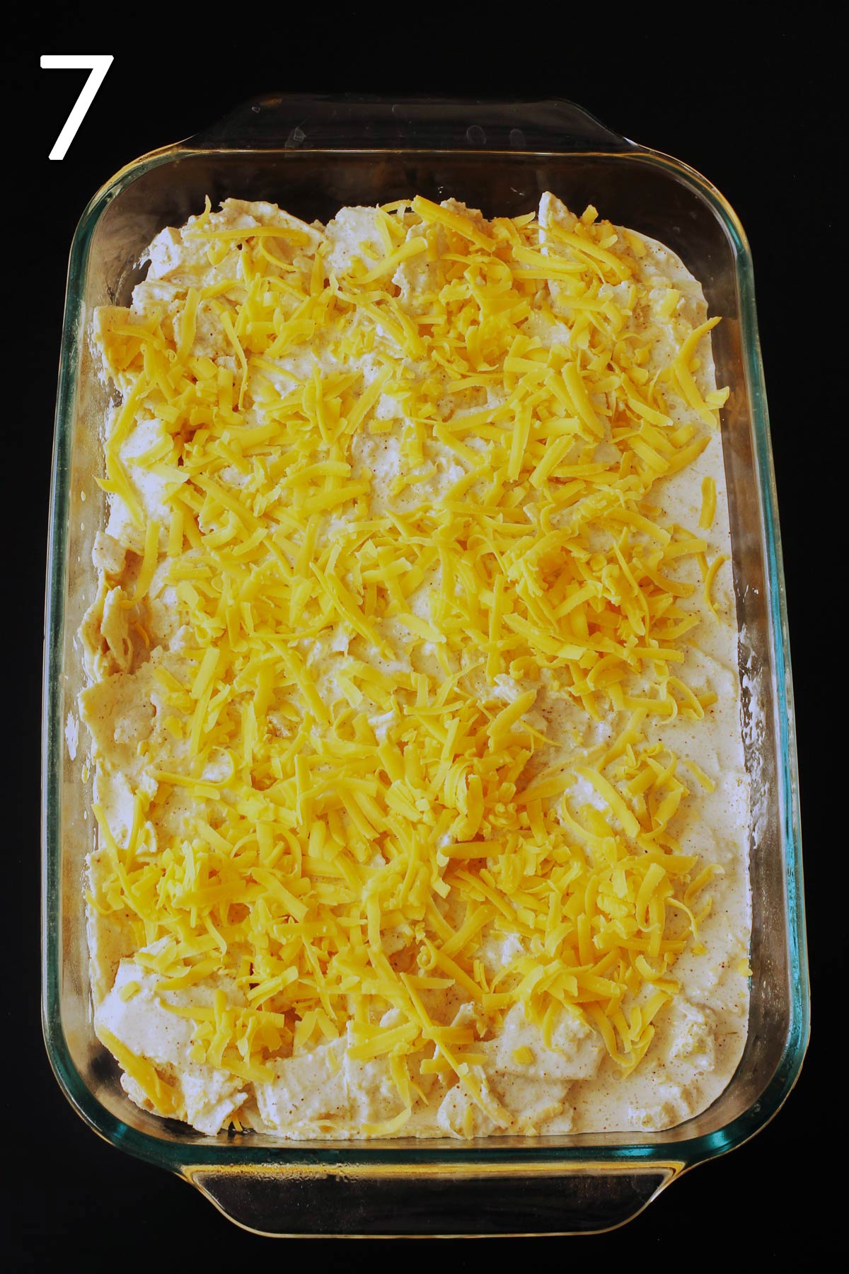 cheese sprinkled over the surface of the tortilla mixture.