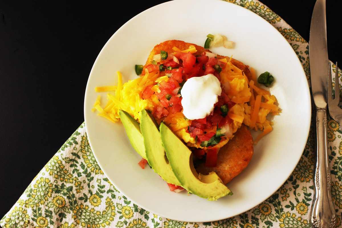 overhead shot of plate of hash brown breakfast stacks