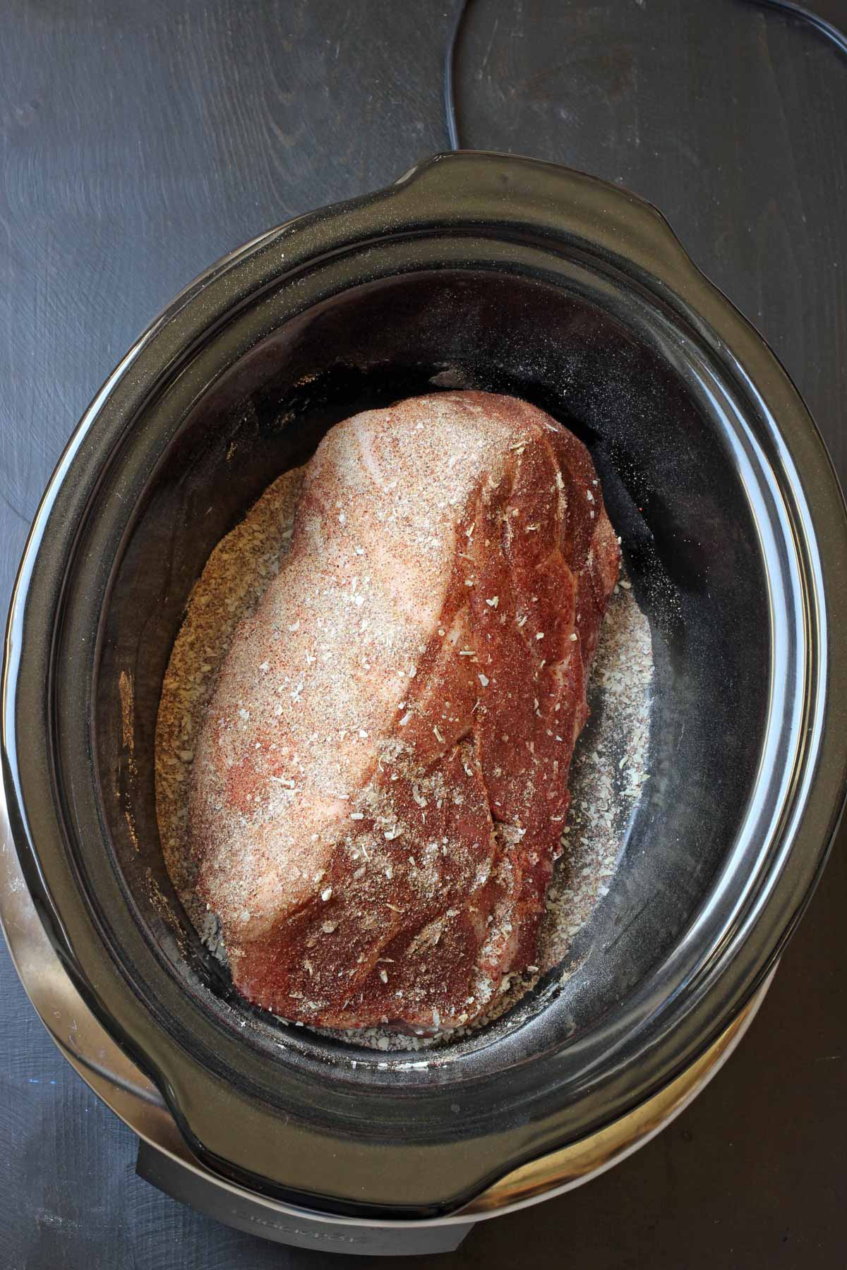 pork shoulder in slow cooker with spices