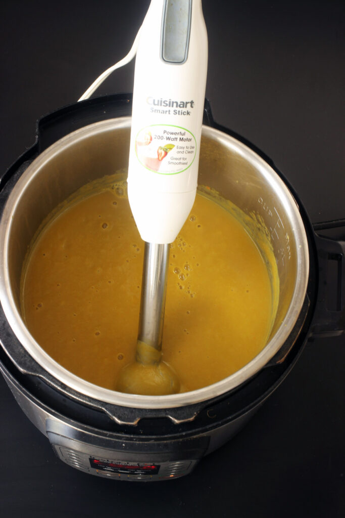 blending soup in pot