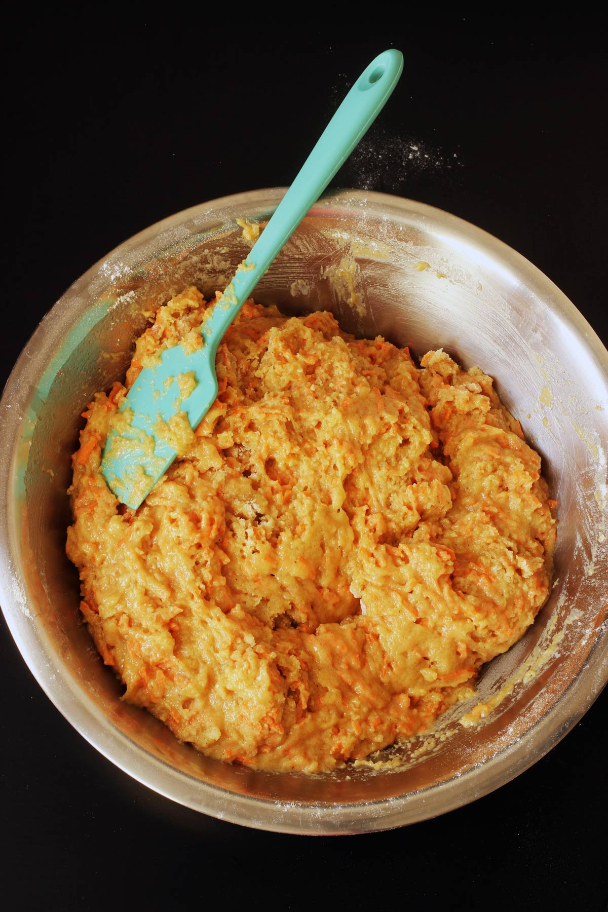 mixed batter in bowl with spatula.