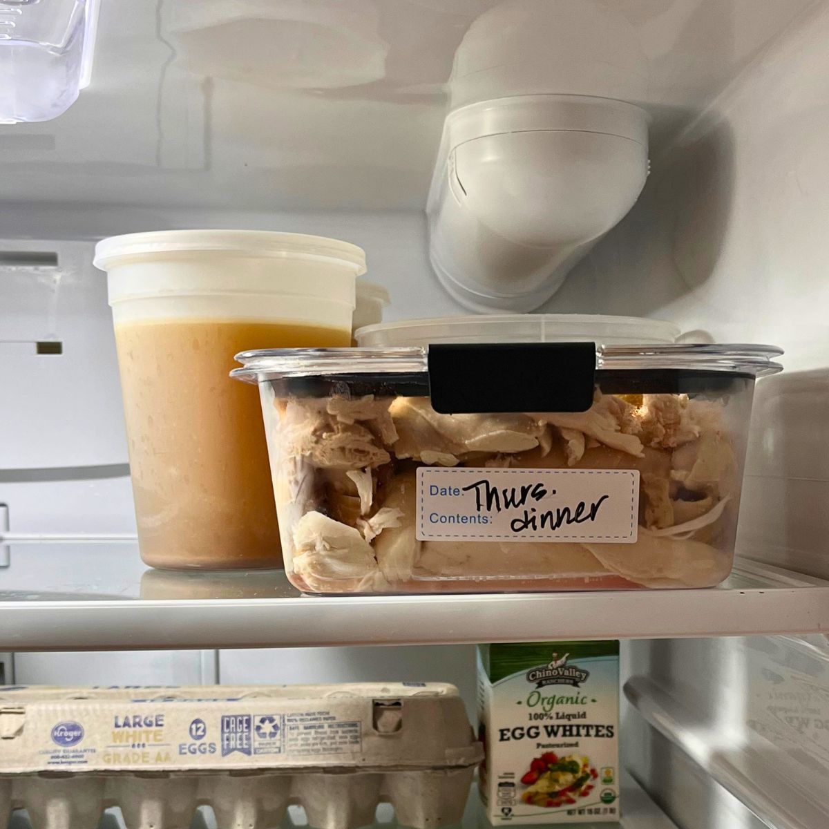 leftovers on top shelf of fridge.