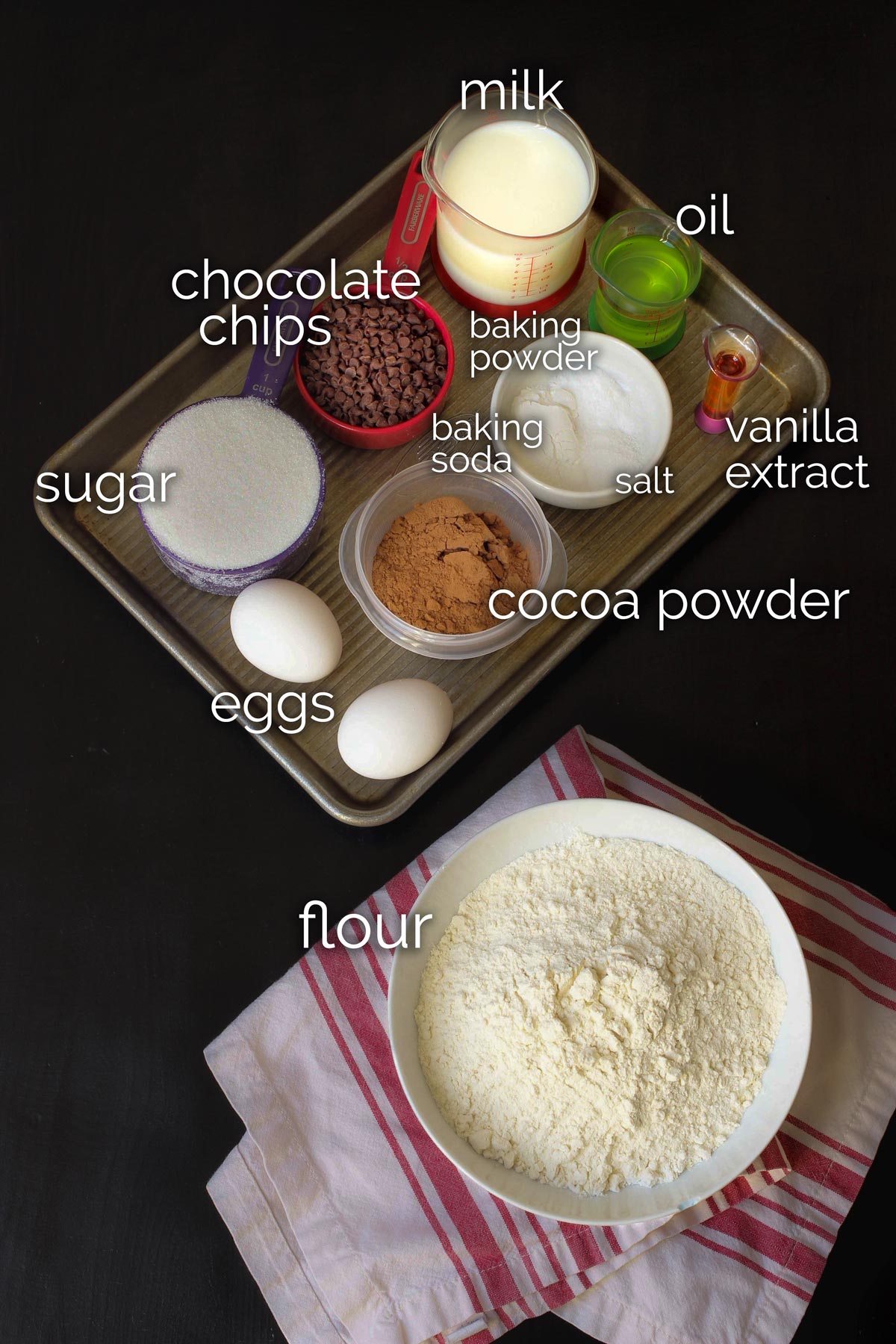 ingredients for chocolate donuts laid out on the table top.