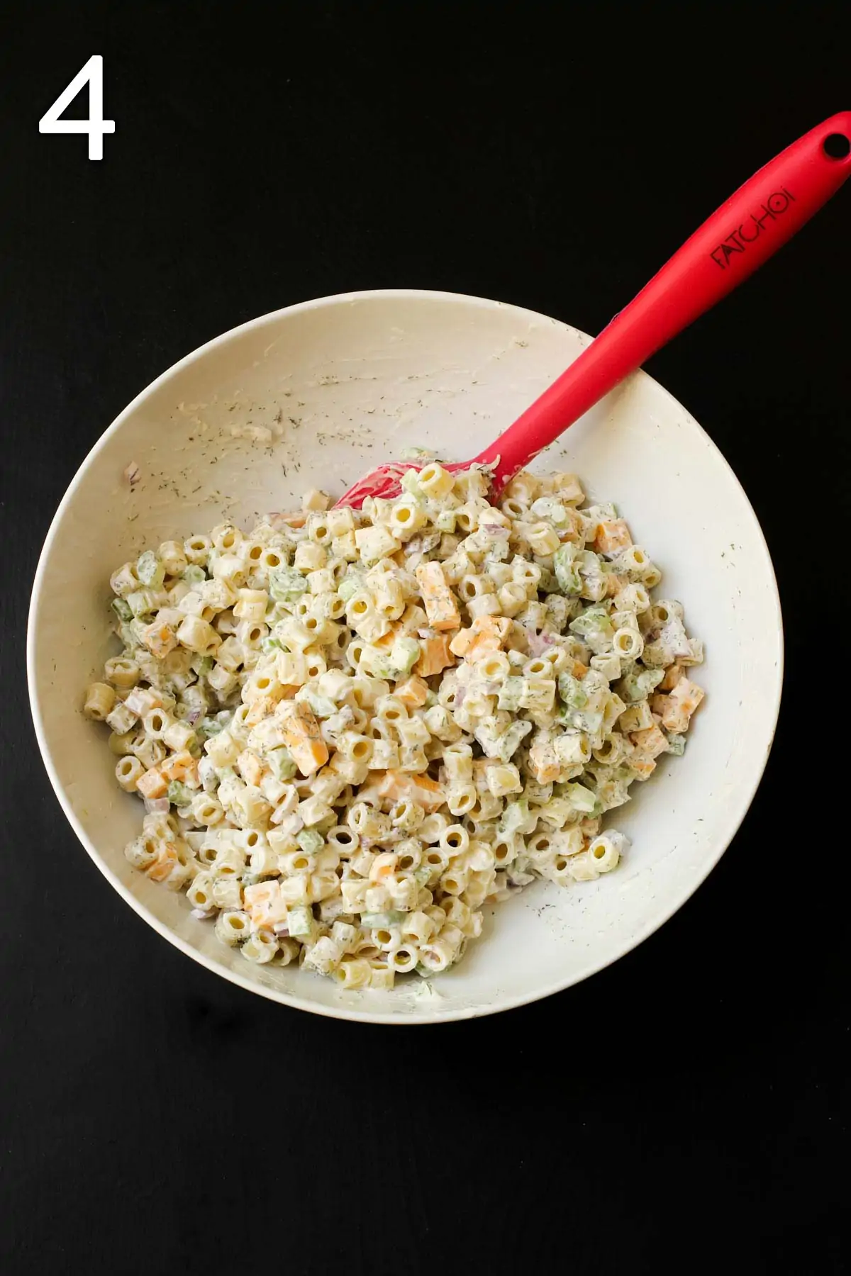 the completed salad in the white bowl.