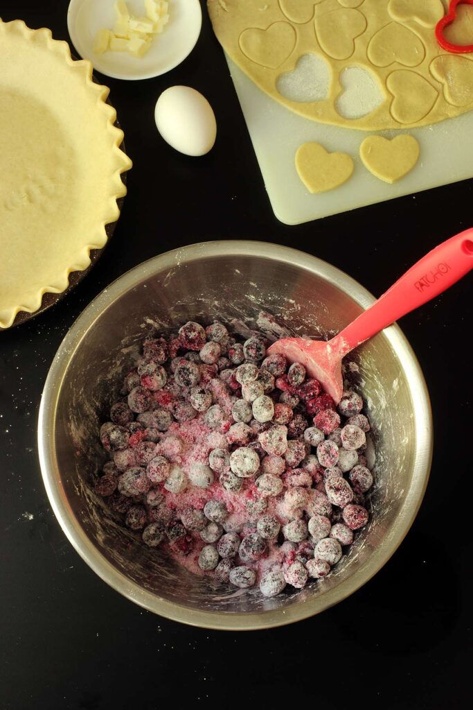 blueberry filling mixed in silver mixing bowl.