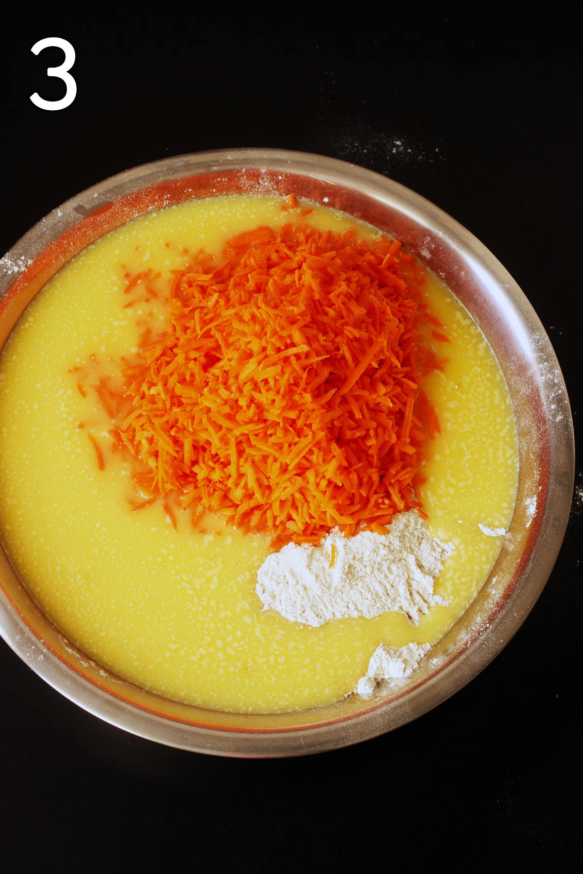 adding wet to dry in large bowl as well as the carrots.