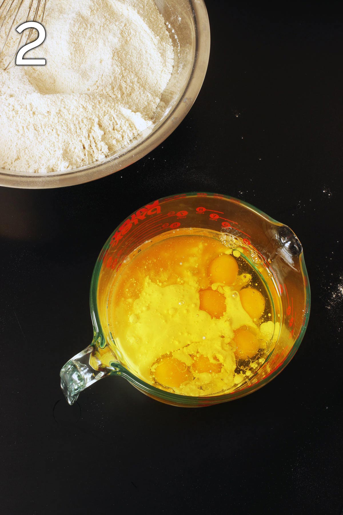 eggs, oil, buttermilk, and vanilla in glass mixing bowl.