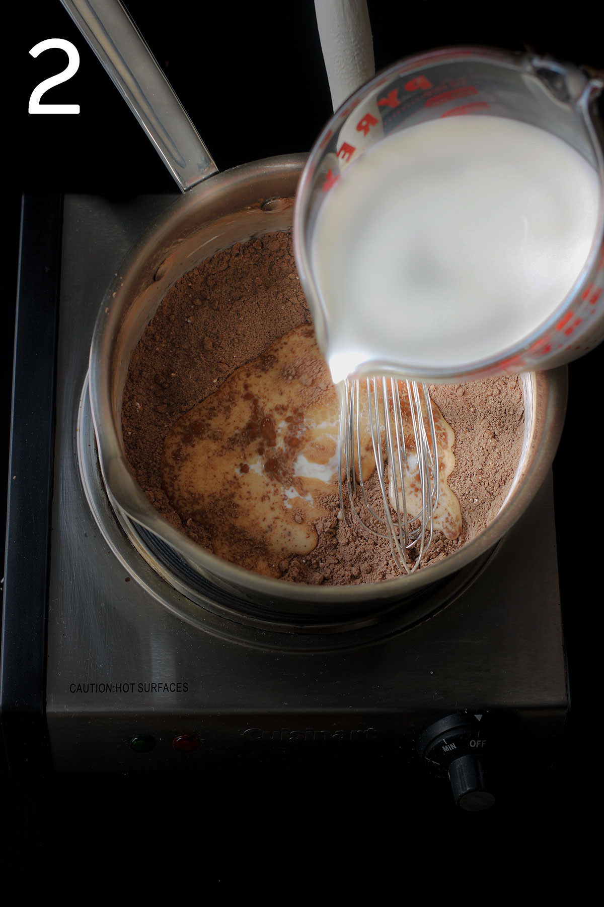 adding milk to the dry ingredients in the saucepan.