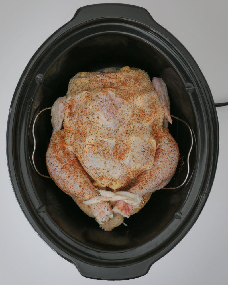 chicken on rack in the slow cooker.