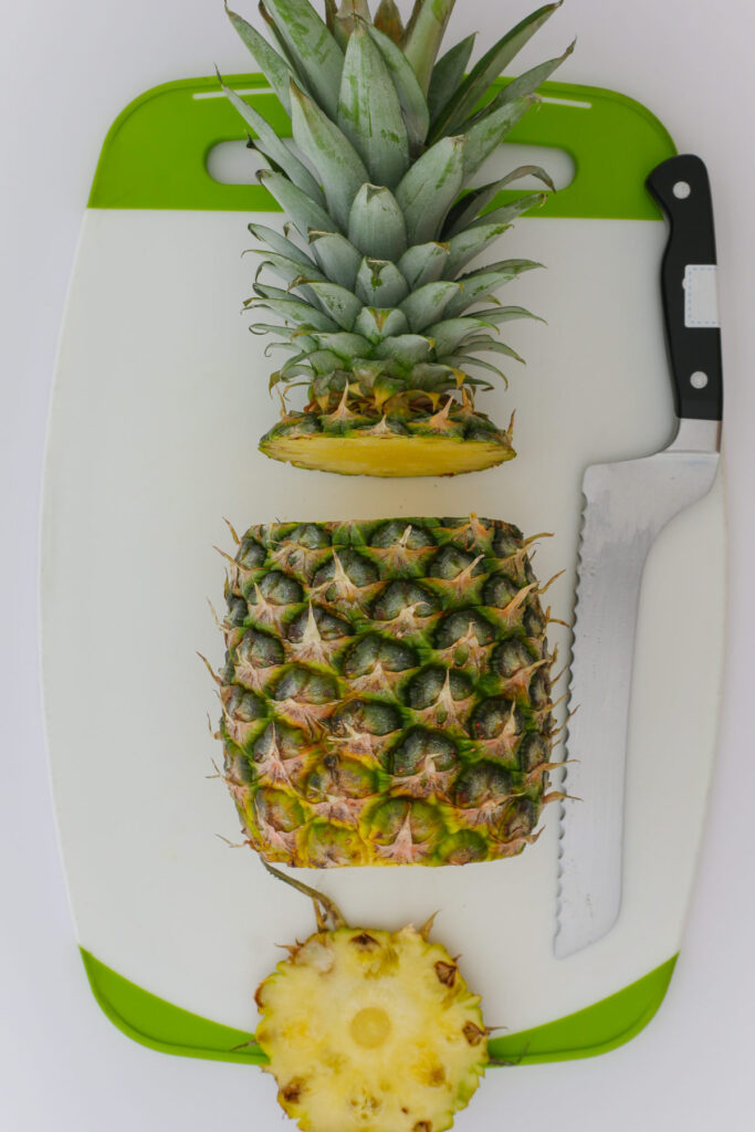 both the top and bottom cut off the pineapple.