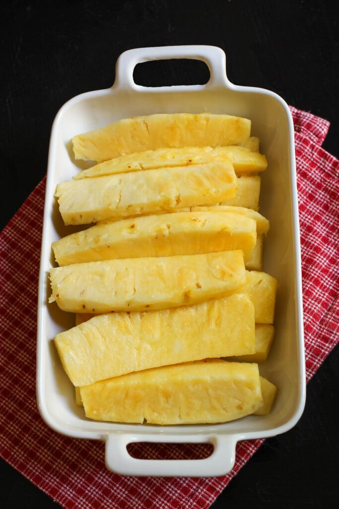 spears of pineapple in rectangular dish.
