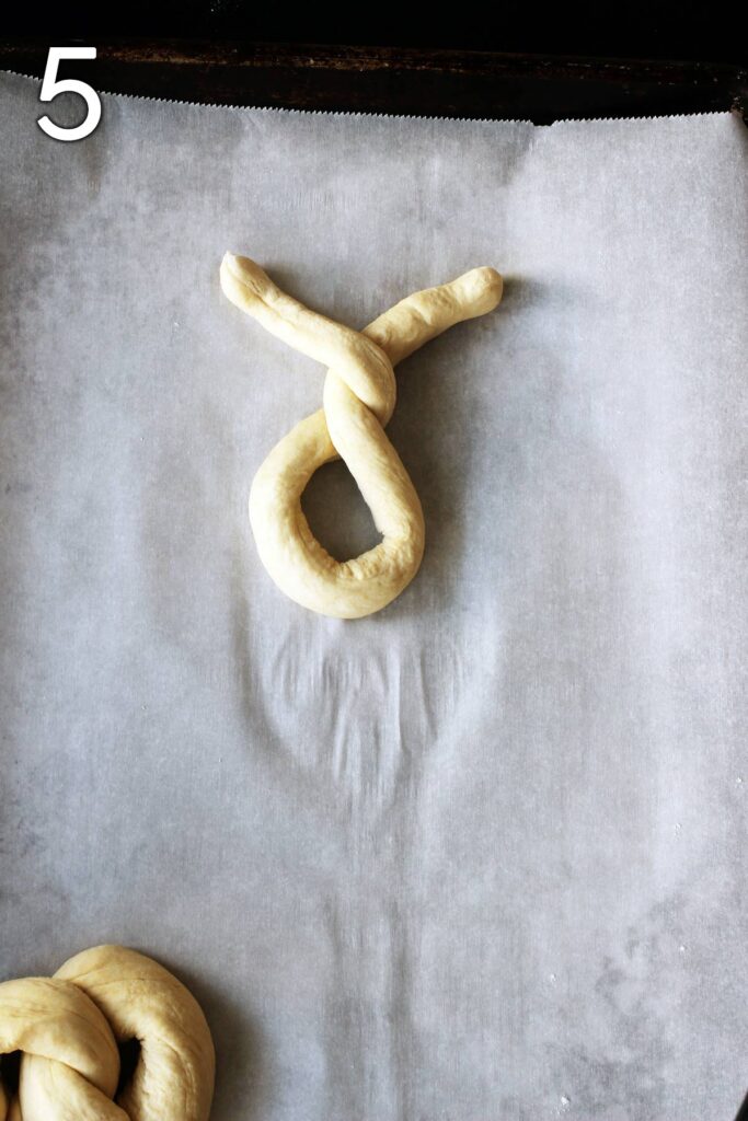 pretzel with the double twist on parchment paper.