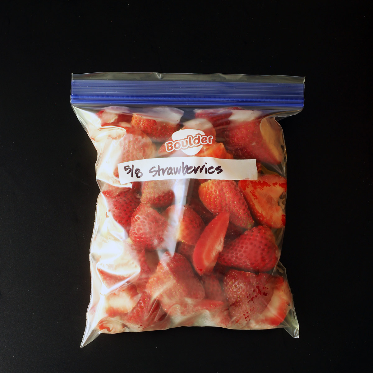 ziptop freezer bag of frozen strawberries.