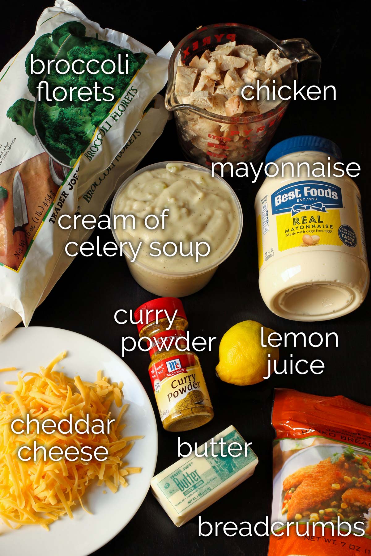 ingredients for curried chicken divan laid on black tabletop.