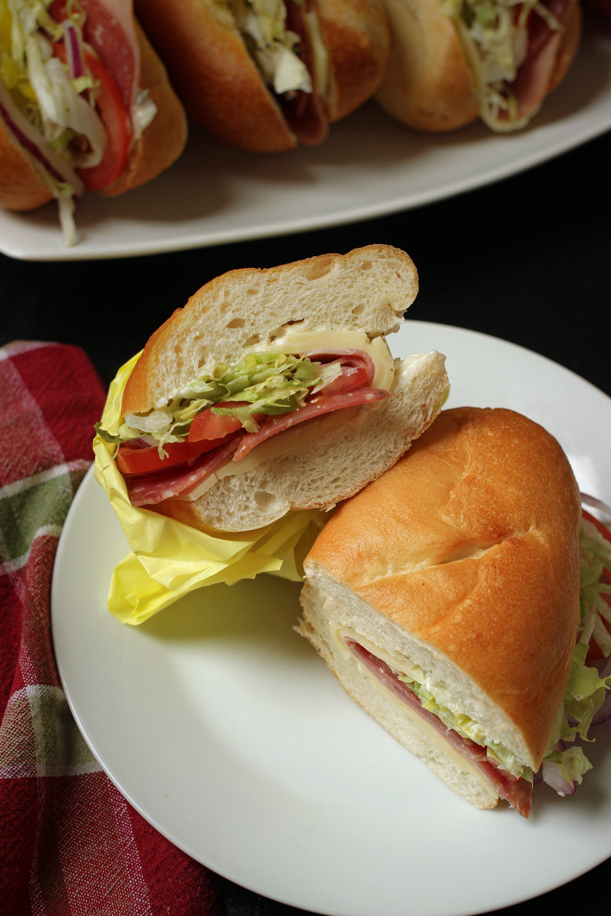 Ham salad with cheese takeaway sandwich on white bread in plastic