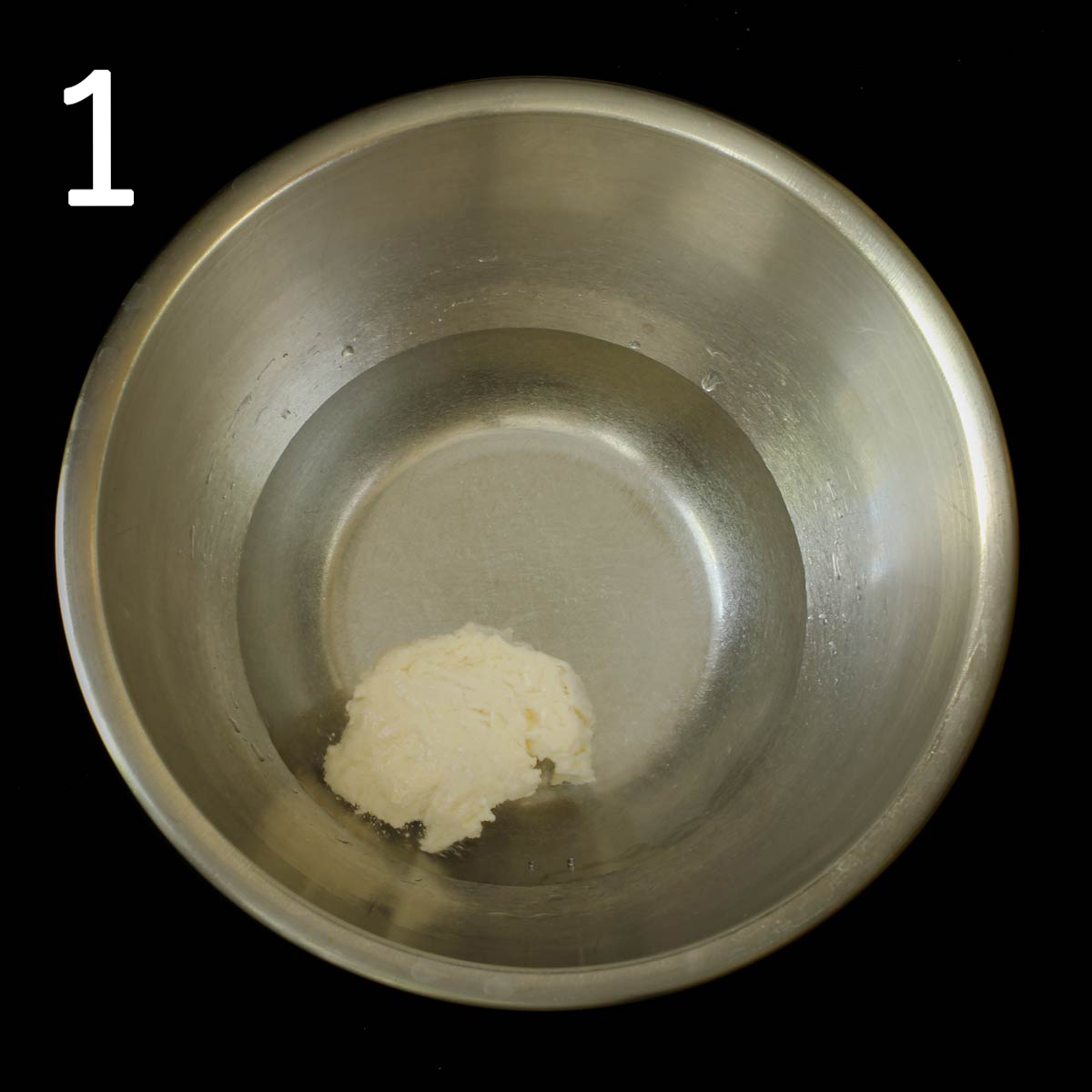 sourdough starter floating in water in a mixing bowl.