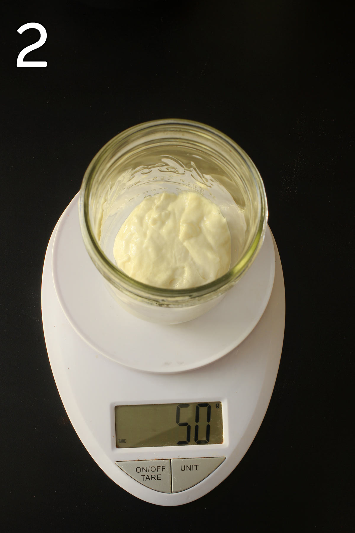 50 grams of sourdough starter in mason jar on scale.