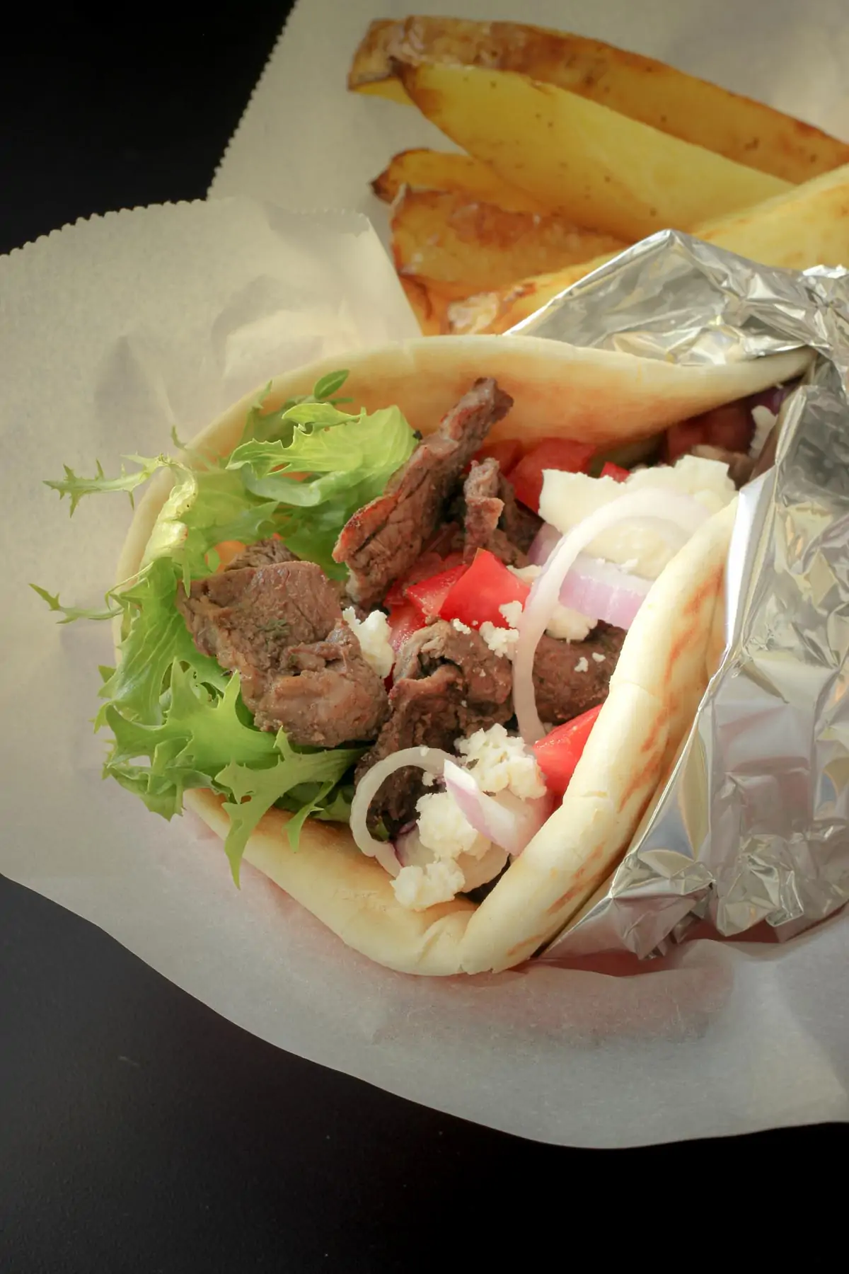 grilled sirloin tip steak chopped and tucked into a pita sandwich.