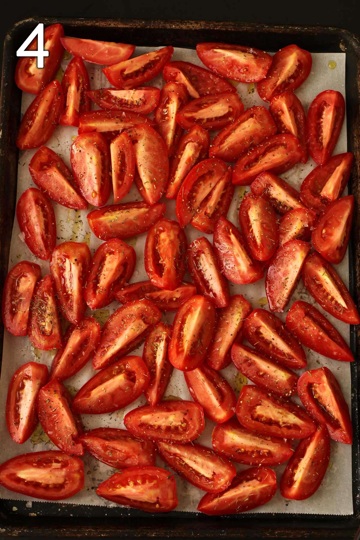 the tomatoes seasoned and ready for roasting.