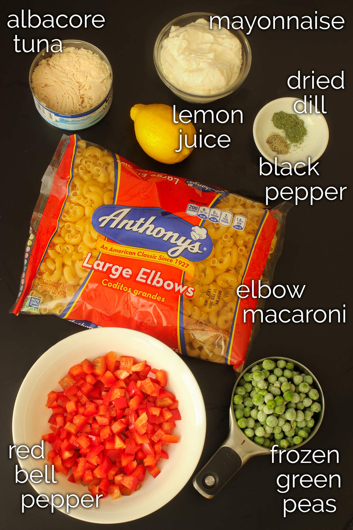 ingredients for tuna mac salad laid out on table top.