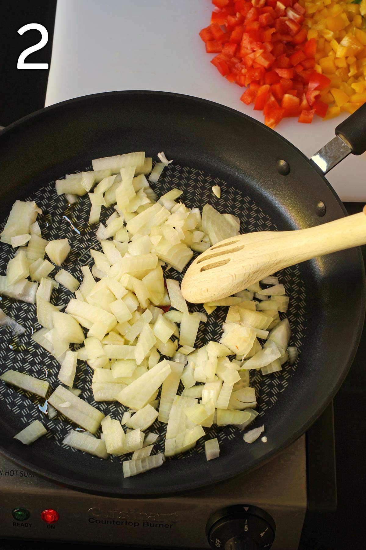 sauteeing the onions in a large skillet.