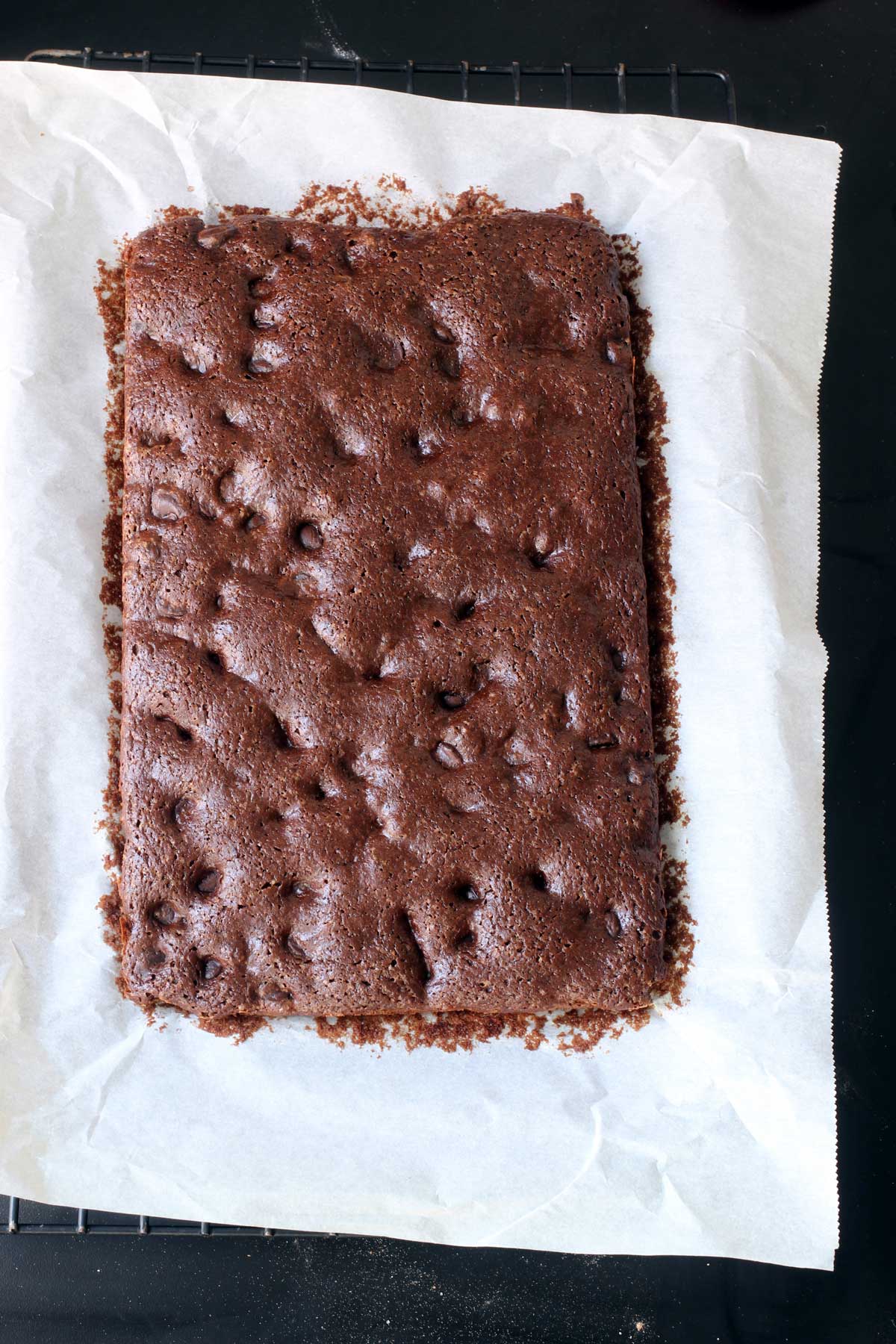 slab of brownies on a large piece of white parchment.