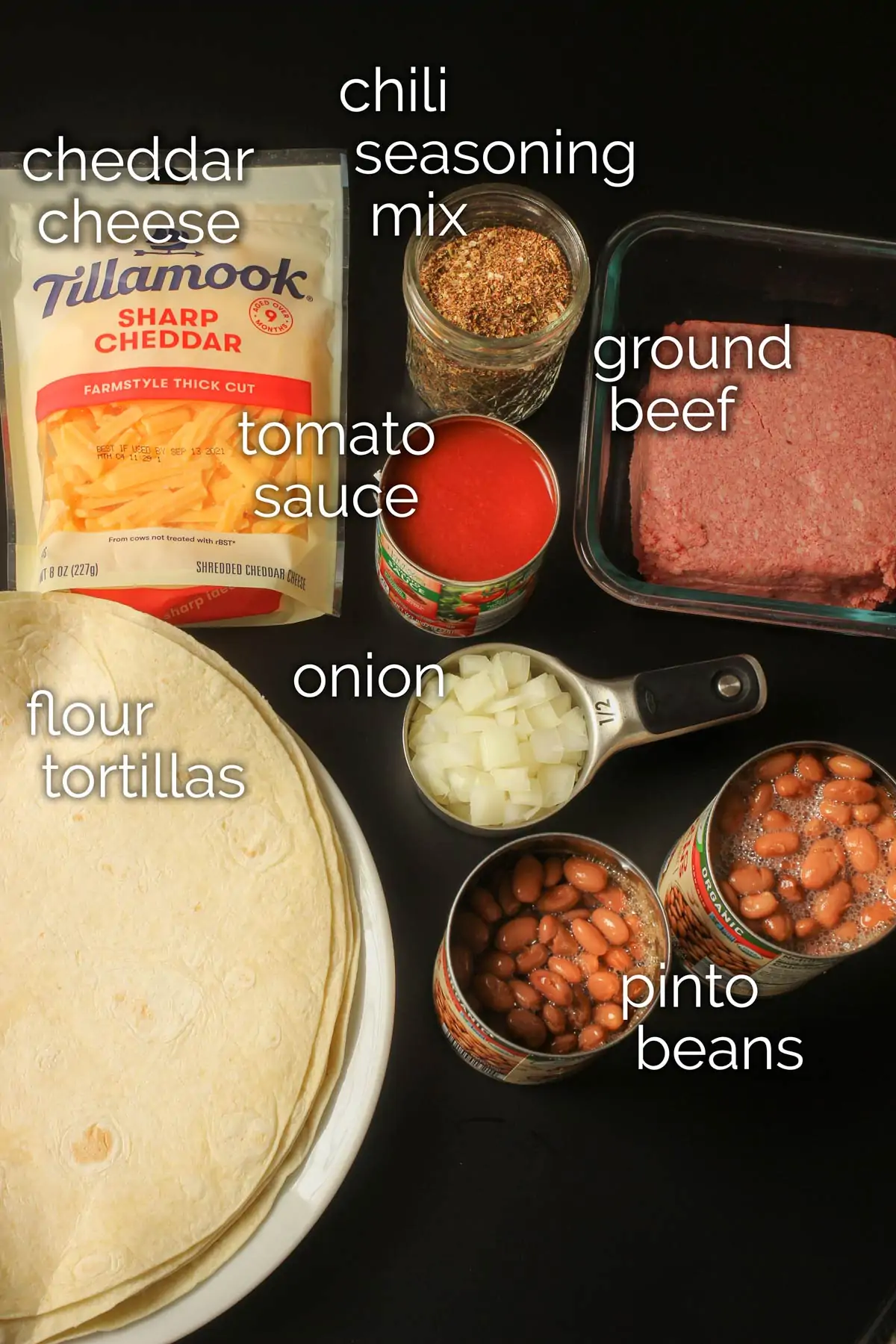 ingredients for chili cheese burritos laid out on tabletop.