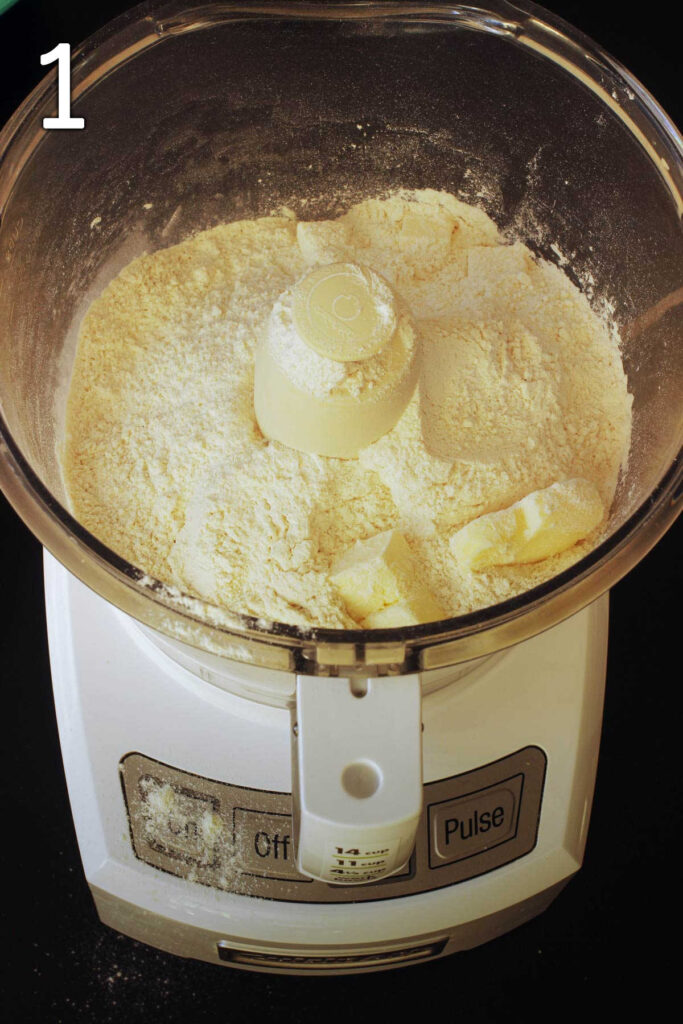 butter, flour, and leaveners added to food processor bowl fitted with metal blade.