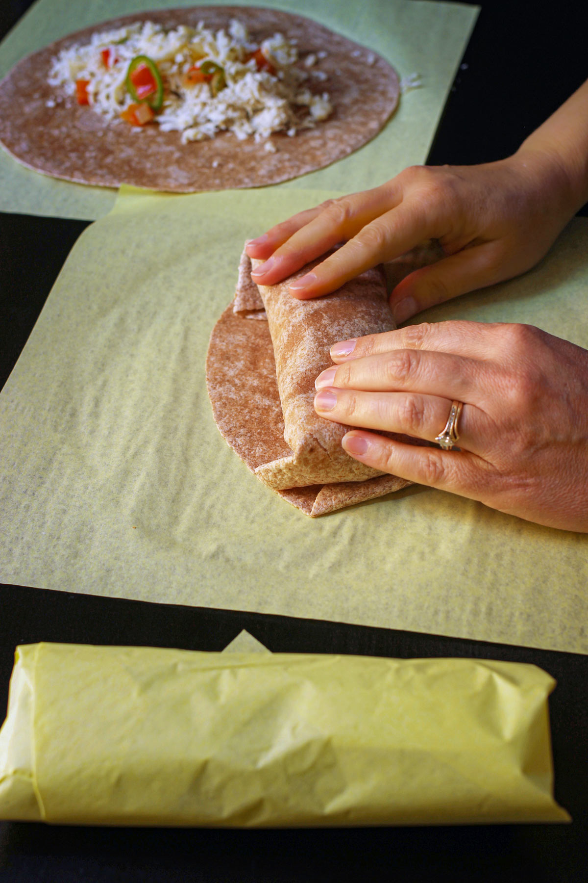 hand rolling the burrito the rest of the way.
