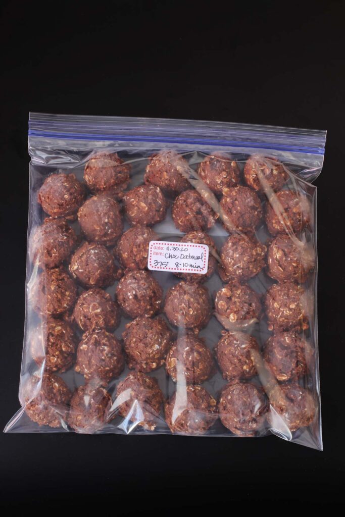 frozen cookie dough balls in a ziptop freezer bag.