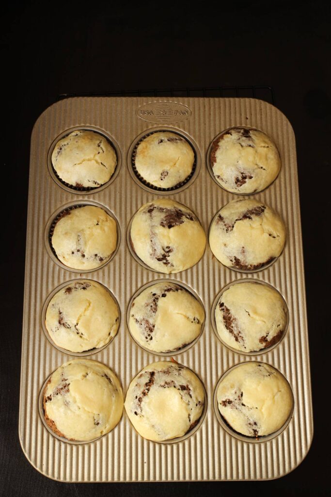 chocolate cream cheese muffins baked in pan.