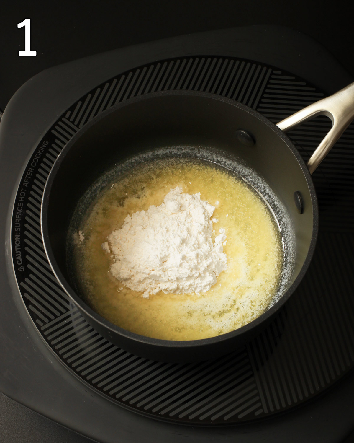 mixing flour and butter for a roux in a saucepan.