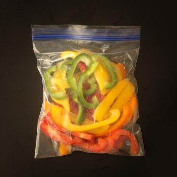 frozen bell pepper strips in a ziptop freezer bag.