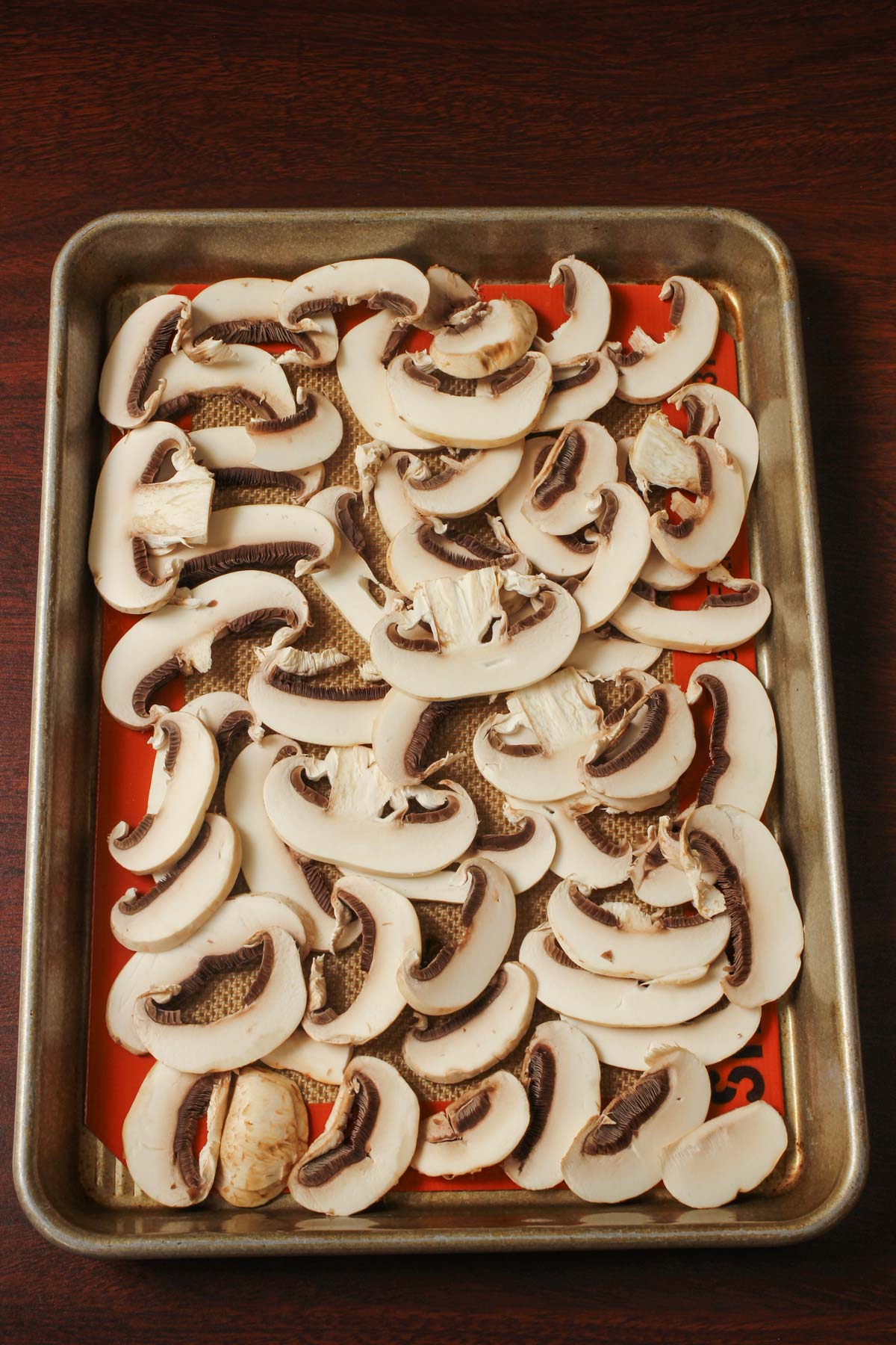 sliced mushrooms on a silpat-lined tray to freeze.