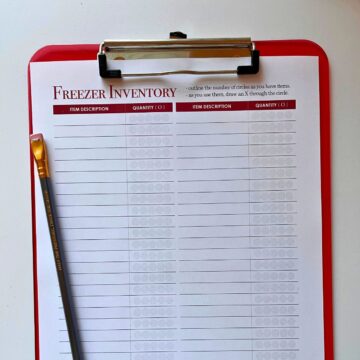 square crop of freezer inventory sheet on red clipboard.
