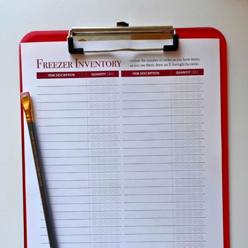 square crop of freezer inventory sheet on red clipboard.