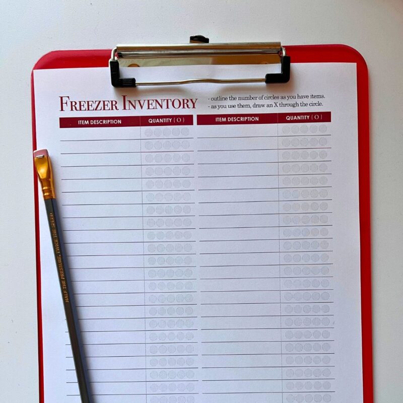square crop of freezer inventory sheet on red clipboard.
