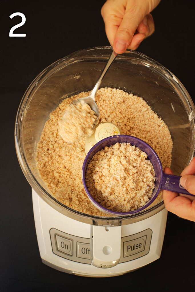 removing one cup of the crumb mixture from the food processor bowl.