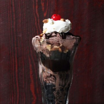 ice cream sundae with chocolate ice cream, sauce, and brownies.