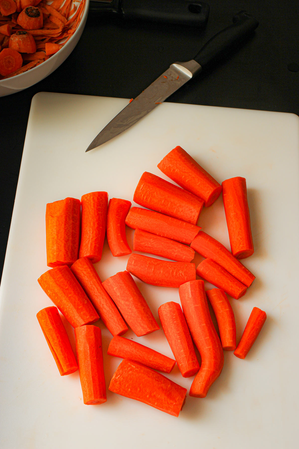 cutting the carrots into stick-length chunks.