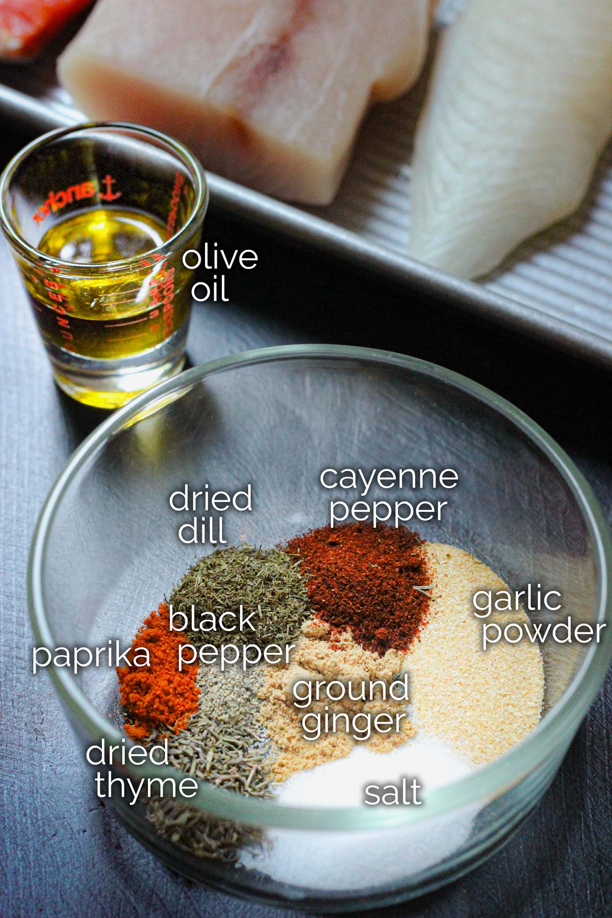 ingredients for fish seasoning in glass dish.