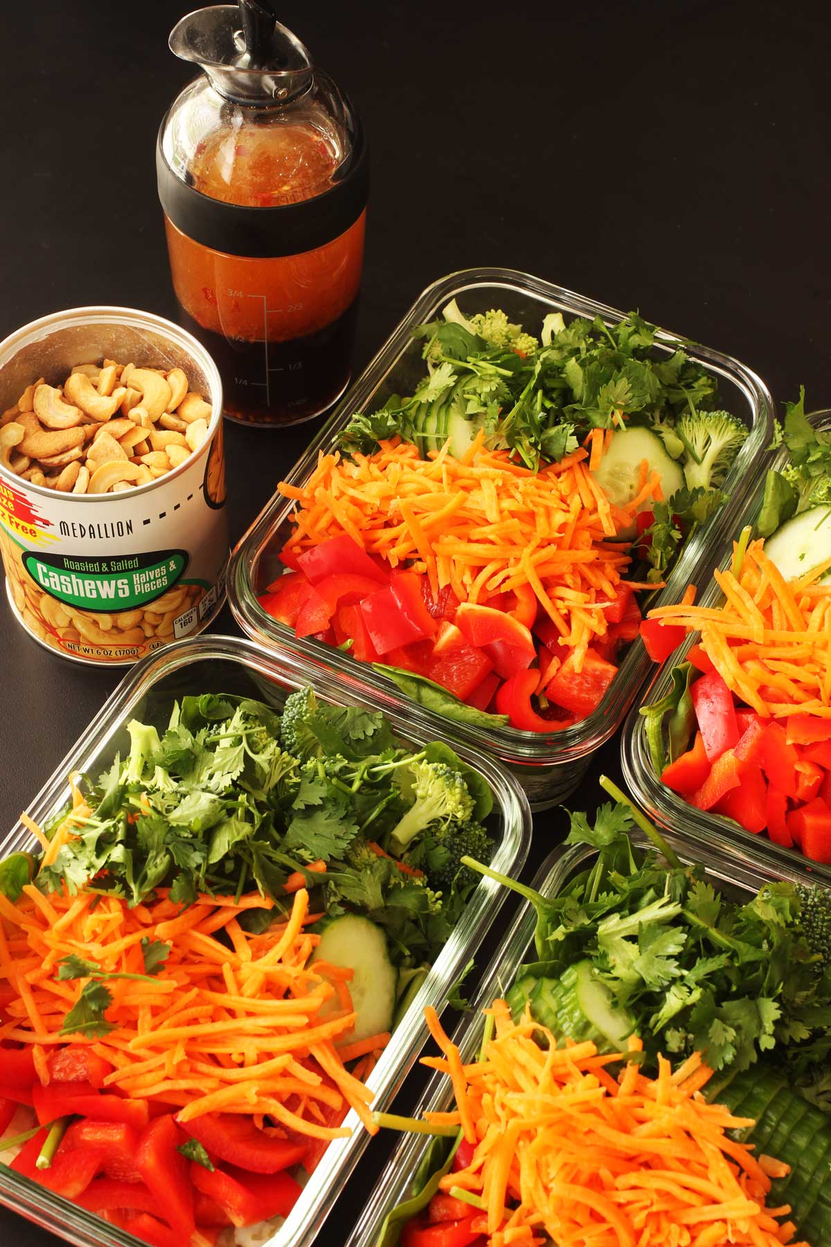 meal prep salads in glass dishes.